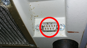 Lower vent panel — hidden serial port
